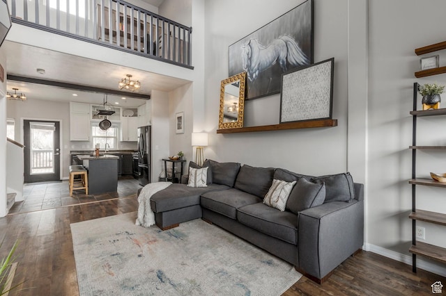 12268 N Ross Creek Dr, Kamas, UT 84036 - living room with dark wood-style floors and baseboards