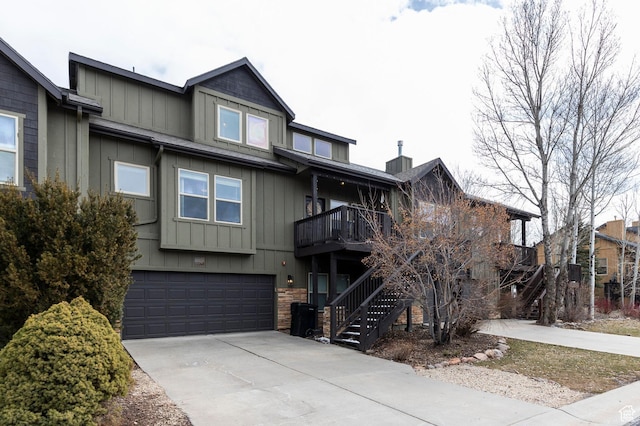 12268 N Ross Creek Dr, Kamas, UT 84036 - view of property with an attached garage, stairs, board and batten siding, and driveway