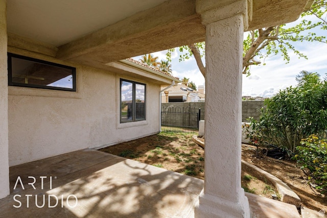 view of patio featuring fence
