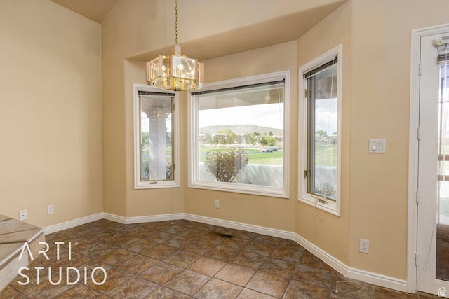 unfurnished dining area with a chandelier, visible vents, and baseboards