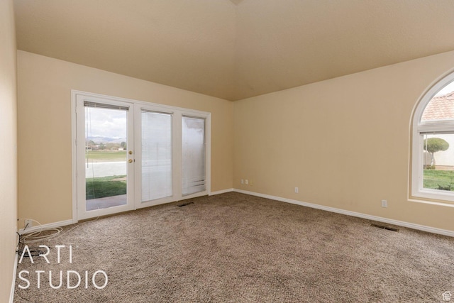 unfurnished room with visible vents, baseboards, and carpet floors