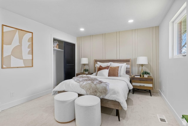bedroom with light colored carpet, baseboards, visible vents, and recessed lighting