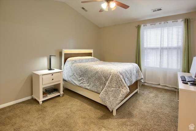 bedroom featuring light colored carpet, baseboards, vaulted ceiling, and visible vents