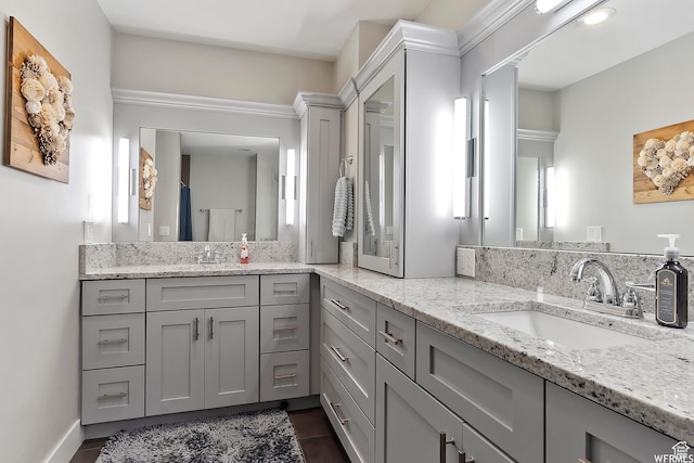 bathroom featuring tile patterned flooring and vanity