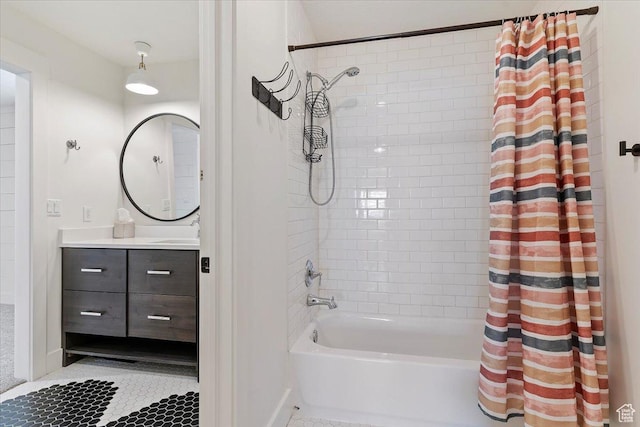 full bathroom featuring tile patterned flooring, shower / bath combo with shower curtain, and vanity