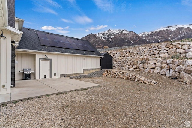 view of yard with a patio and a mountain view