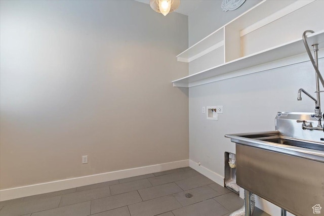 laundry room with laundry area, baseboards, and hookup for a washing machine