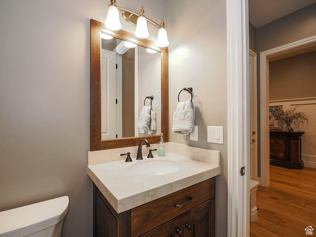 1979 E Olympus Point Dr, Holladay, UT 84117 - bathroom with toilet, wood finished floors, and vanity