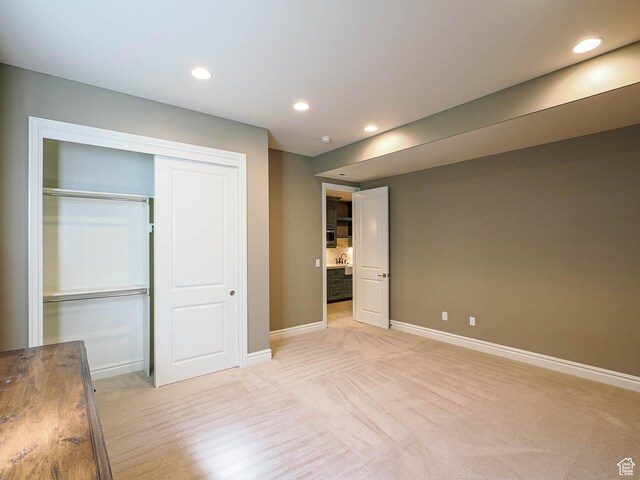 1979 E Olympus Point Dr, Holladay, UT 84117 - unfurnished bedroom featuring a closet, baseboards, recessed lighting, and light colored carpet