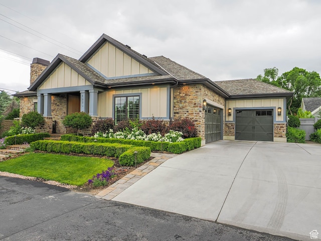 1979 E Olympus Point Dr, Holladay, UT 84117 - craftsman house with an attached garage, stone siding, a chimney, board and batten siding, and concrete driveway