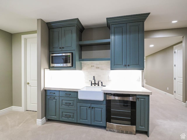 1979 E Olympus Point Dr, Holladay, UT 84117 - kitchen with light colored carpet, stainless steel microwave, a sink, beverage cooler, and backsplash