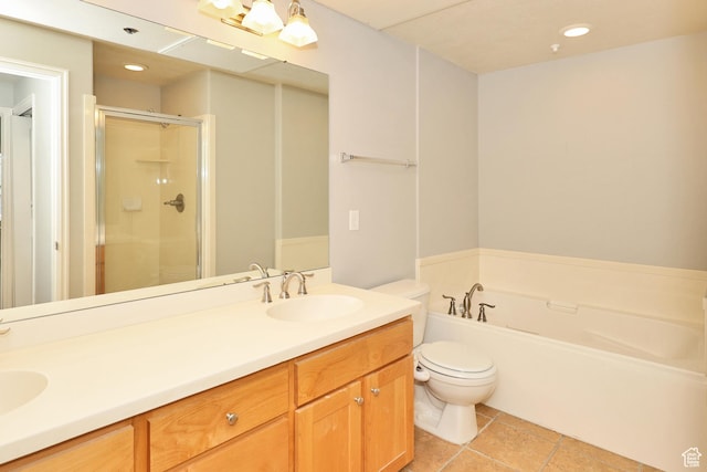 full bathroom featuring double vanity, toilet, a shower stall, a bath, and a sink