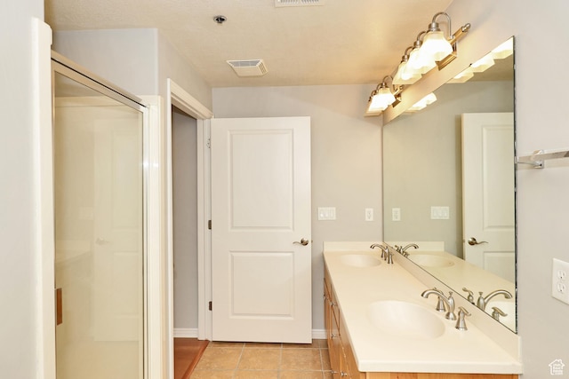 full bathroom with a sink, visible vents, and tile patterned floors