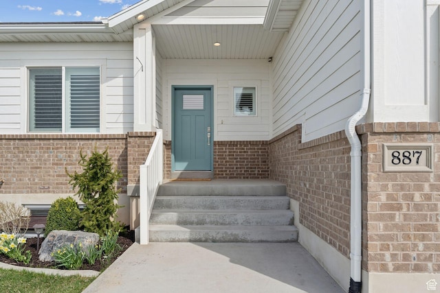 887 S 3050 W, Syracuse, UT 84075 - view of exterior entry featuring brick siding