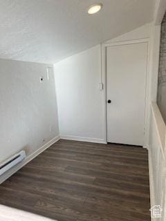 56 E Center St Unit 1, Richfield, UT 84701 - spare room with a baseboard heating unit, vaulted ceiling, baseboards, recessed lighting, and wood finished floors
