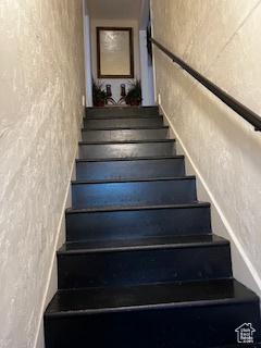 56 E Center St Unit 1, Richfield, UT 84701 - staircase featuring a textured wall