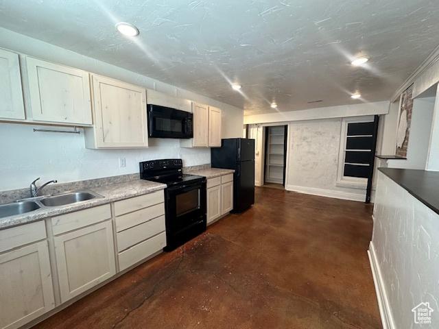 56 E Center St Unit 1, Richfield, UT 84701 - kitchen with black appliances, finished concrete floors, recessed lighting, and light countertops
