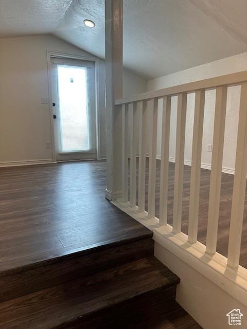 56 E Center St Unit 1, Richfield, UT 84701 - stairs featuring lofted ceiling, wood finished floors, and a textured ceiling