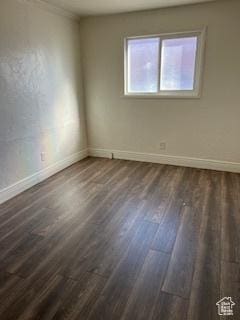 56 E Center St Unit 1, Richfield, UT 84701 - spare room featuring dark wood-type flooring and baseboards