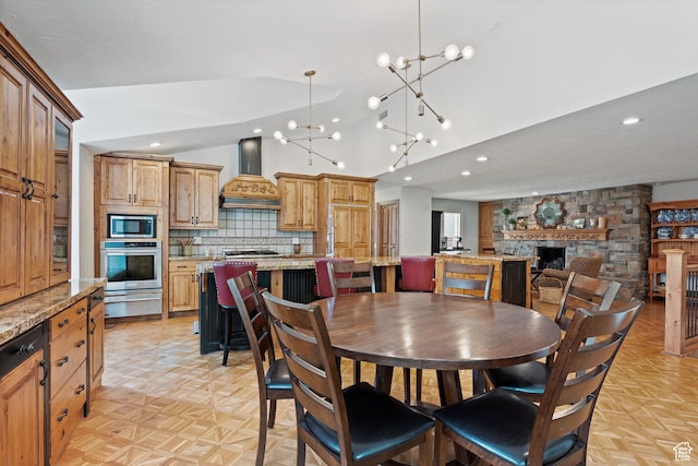 1850 E Cottonwood Club Dr, Holladay, UT 84117 - dining space with high vaulted ceiling, an inviting chandelier, a fireplace, and recessed lighting