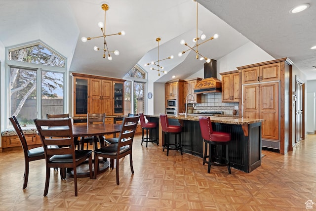 1850 E Cottonwood Club Dr, Holladay, UT 84117 - dining room with high vaulted ceiling, a notable chandelier, and a textured ceiling
