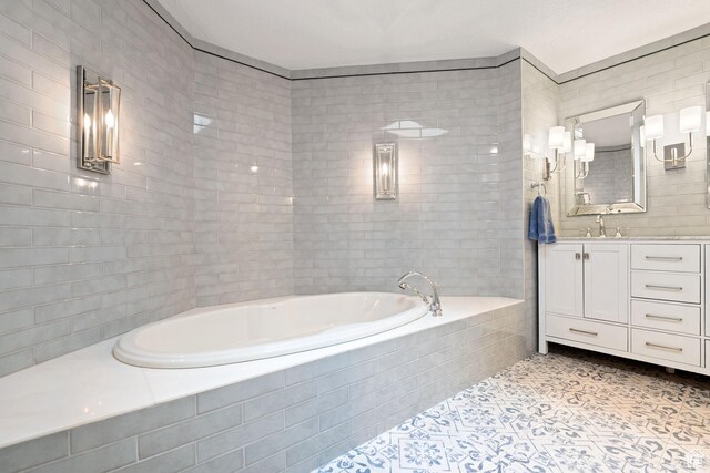 1850 E Cottonwood Club Dr, Holladay, UT 84117 - bathroom with a bath, tile patterned floors, vanity, and tile walls