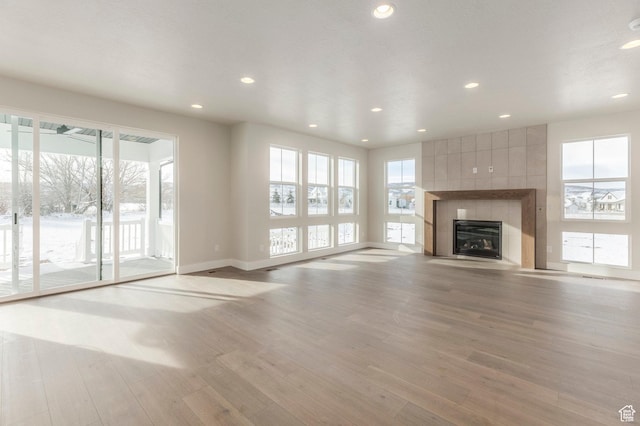 2989 Rock View Dr Unit 105, Francis, UT 84036 - unfurnished living room featuring recessed lighting, a fireplace, and light wood finished floors