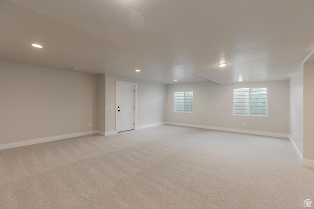 2989 Rock View Dr Unit 105, Francis, UT 84036 - unfurnished room with recessed lighting, light colored carpet, baseboards, and a textured ceiling