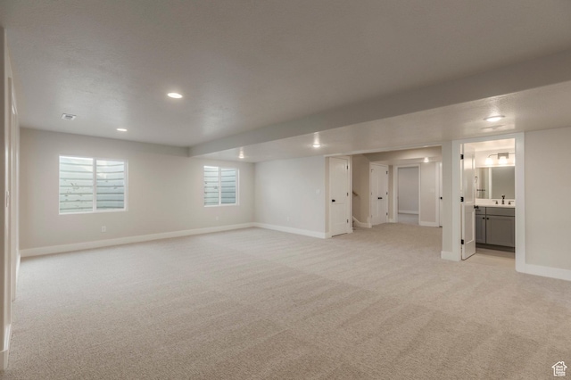2989 Rock View Dr Unit 105, Francis, UT 84036 - basement with a healthy amount of sunlight, light colored carpet, baseboards, and recessed lighting