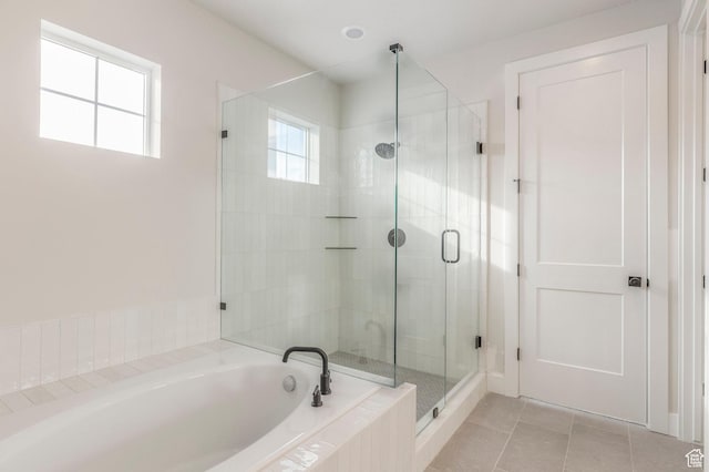 2989 Rock View Dr Unit 105, Francis, UT 84036 - bathroom with a shower stall, a bath, tile patterned flooring, and a wealth of natural light
