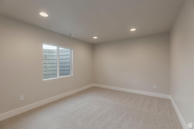 2989 Rock View Dr Unit 105, Francis, UT 84036 - unfurnished room featuring light colored carpet, baseboards, visible vents, and recessed lighting