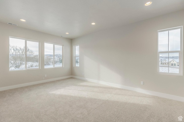 2989 Rock View Dr Unit 105, Francis, UT 84036 - unfurnished room with visible vents, baseboards, recessed lighting, and light carpet