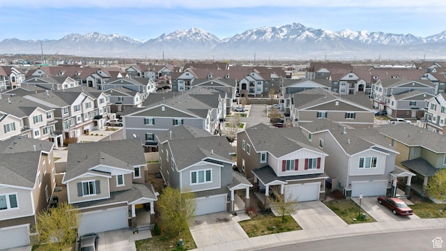 drone / aerial view featuring a mountain view and a residential view