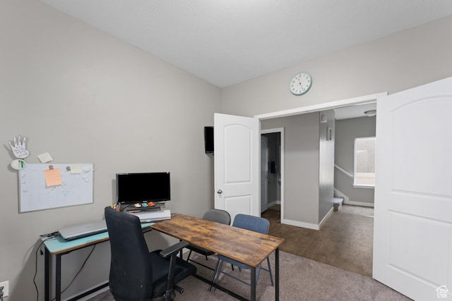 office area featuring baseboards and wood finished floors