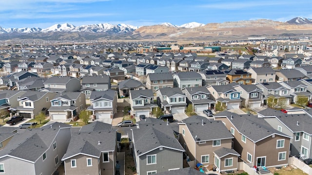 drone / aerial view featuring a residential view and a mountain view