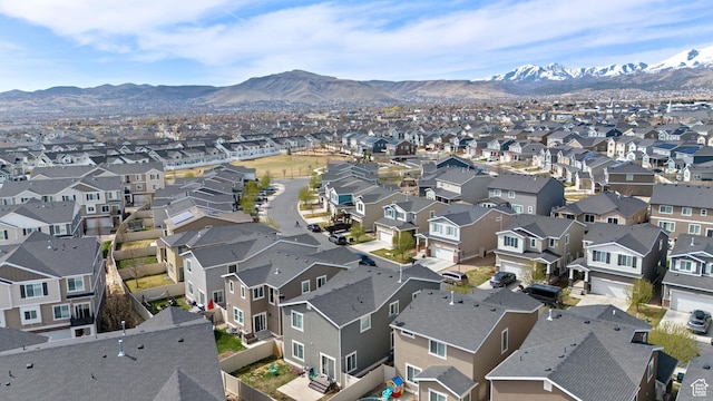 drone / aerial view with a residential view and a mountain view