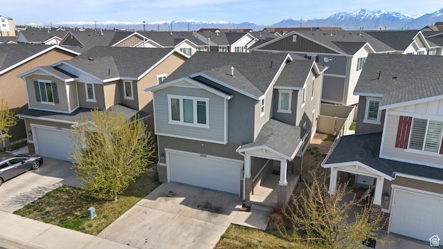 aerial view with a mountain view and a residential view