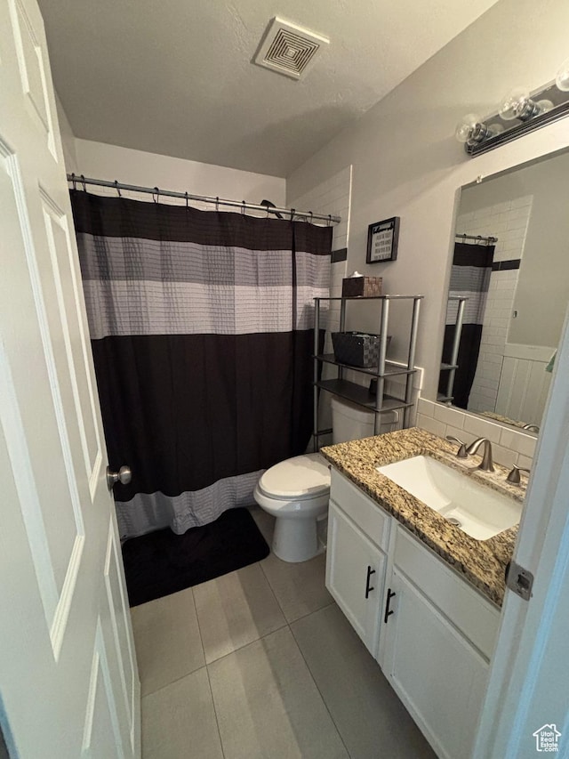 1081 S 900 W, Tooele, UT 84074 - full bath with vanity, visible vents, toilet, tile patterned floors, and backsplash
