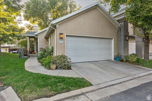 view of property exterior featuring a garage, stucco siding, and concrete driveway