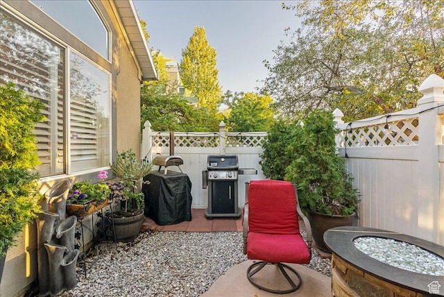 view of patio / terrace with grilling area and fence