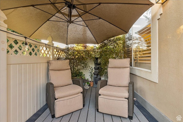 wooden terrace featuring an outdoor hangout area