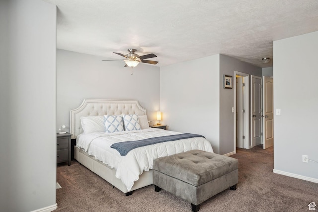 carpeted bedroom with a textured ceiling, ceiling fan, and baseboards