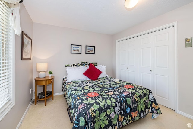 2406 Woodland Dr, Ogden, UT 84403 - bedroom featuring a closet, baseboards, and carpet flooring
