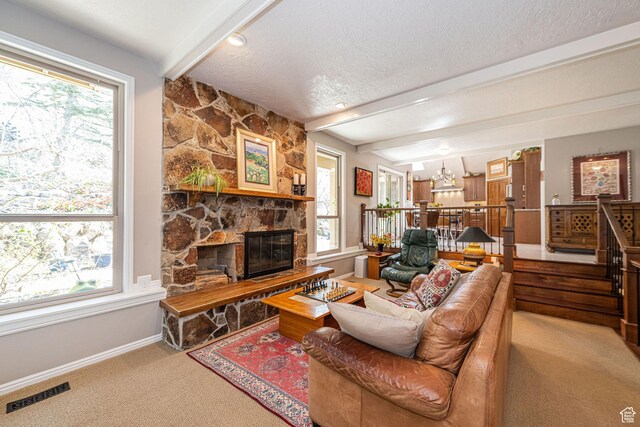 2406 Woodland Dr, Ogden, UT 84403 - carpeted living area with visible vents, baseboards, a fireplace, a textured ceiling, and beam ceiling