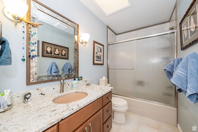 2406 Woodland Dr, Ogden, UT 84403 - full bath featuring toilet, enclosed tub / shower combo, vanity, and tile patterned flooring