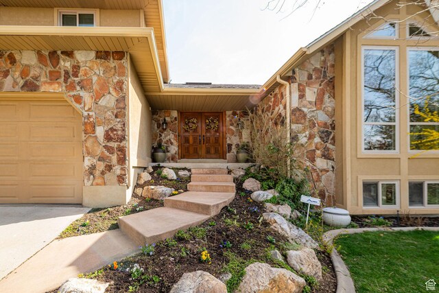 2406 Woodland Dr, Ogden, UT 84403 - view of exterior entry featuring stucco siding and stone siding