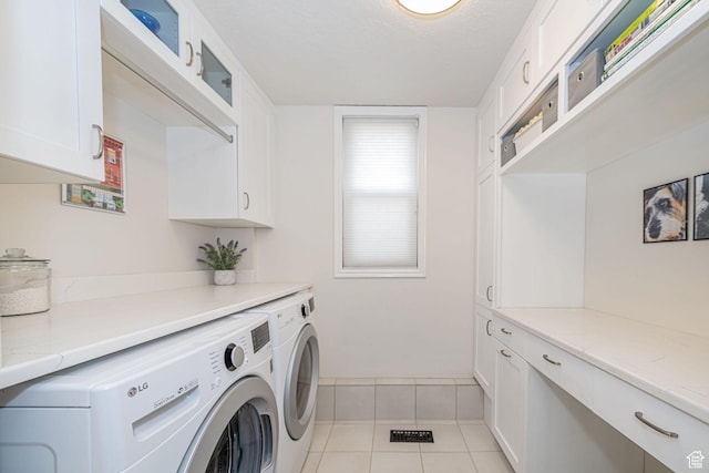 2406 Woodland Dr, Ogden, UT 84403 - washroom featuring a textured ceiling, light tile patterned flooring, cabinet space, and washer and clothes dryer
