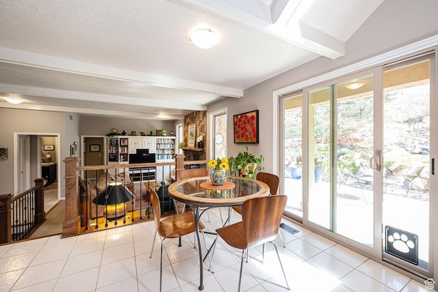 2406 Woodland Dr, Ogden, UT 84403 - dining room featuring visible vents, beamed ceiling, light tile patterned floors, and a textured ceiling