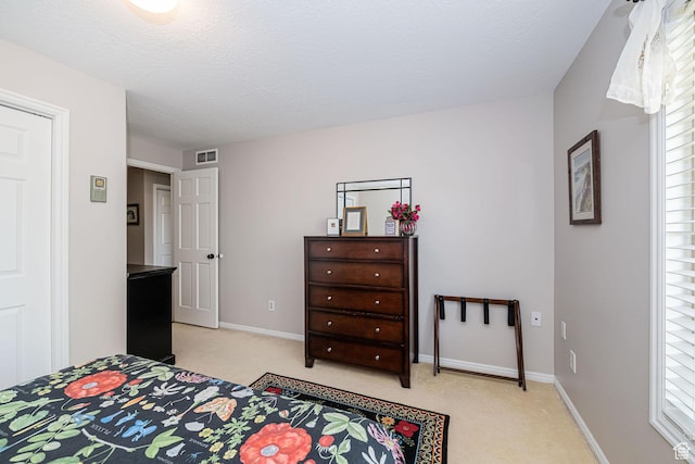 2406 Woodland Dr, Ogden, UT 84403 - bedroom featuring light carpet, baseboards, multiple windows, and visible vents