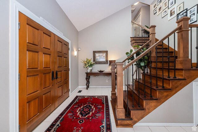 2406 Woodland Dr, Ogden, UT 84403 - entryway featuring baseboards, stairway, light tile patterned flooring, and lofted ceiling